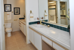 Spacious master bathroom with many storage space.