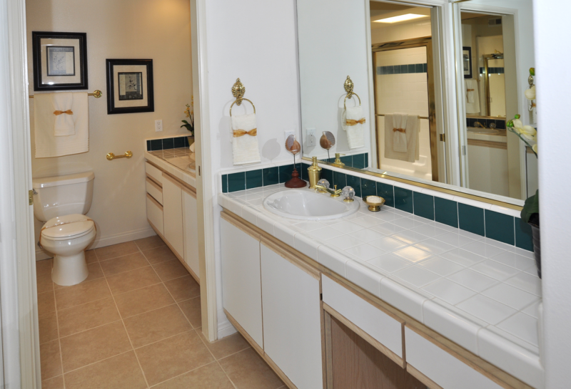 Spacious master bathroom with many storage space.