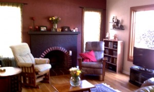 Fireplace and a large window accents the Spanish home.