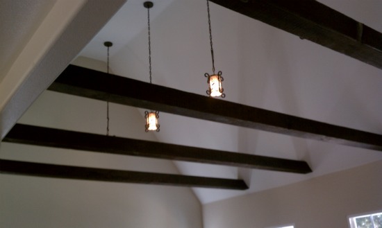 Cathedral vaulted ceiling features 3026 Olive Avenue English Tudor.