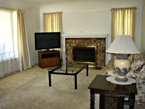 Living room has wonderful batchelder fireplace