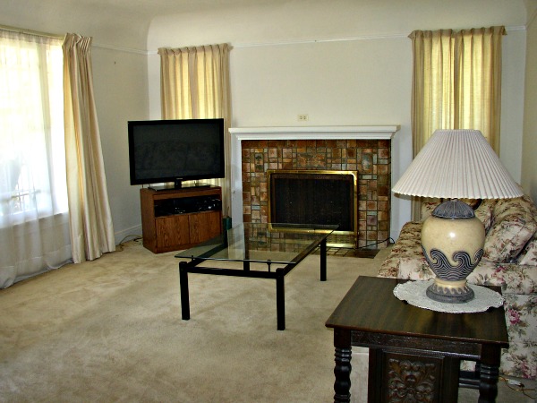 Living room has wonderful batchelder fireplace